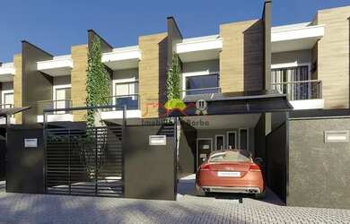 Imagem: A casa possui 3 Dormitórios, 3 Banheiros, 2 Vagas na garagem