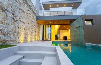 Imagem: A casa em condomínio possui 4 Dormitórios, 5 Banheiros, 4