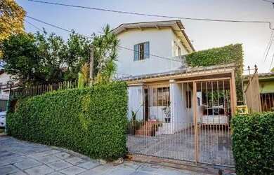Imagem: A casa possui 5 Dormitórios, 5 Banheiros, 5 Vagas na garagem