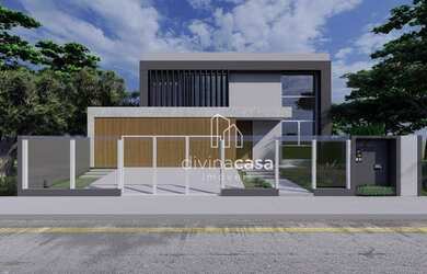 Imagem: A casa possui 3 Dormitórios, 5 Banheiros, 2 Vagas na garagem