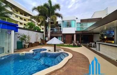 Imagem: A casa possui 4 Dormitórios, 4 Banheiros, 5 Vagas na garagem