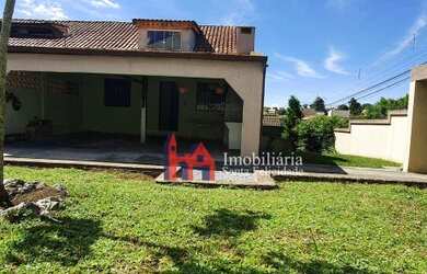 Imagem: A casa possui 3 Dormitórios, 1 Banheiro, 2 Vagas na garagem