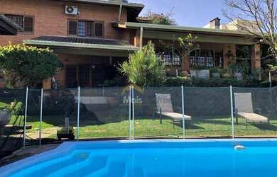 Imagem: A casa em condomínio possui 5 Dormitórios, 5 Banheiros, 4