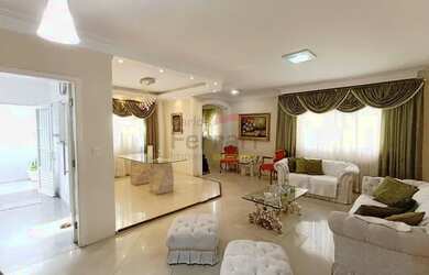 Imagem: A casa possui 3 Dormitórios, 5 Banheiros, 3 Vagas na garagem