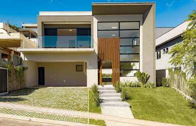 Imagem: A casa em condomínio possui 4 Dormitórios, 5 Banheiros, 4