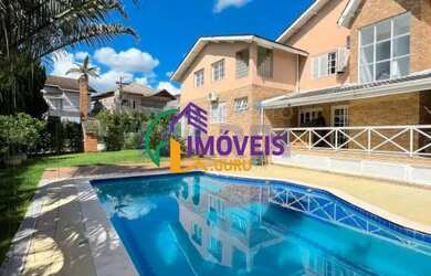 Imagem: A casa em condomínio possui 4 Dormitórios, 5 Banheiros, 4