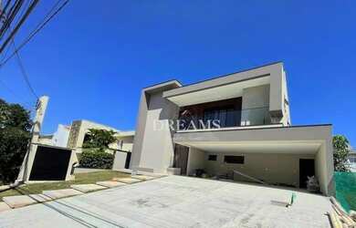 Imagem: A casa possui 4 Dormitórios, 5 Banheiros, 5 Vagas na garagem