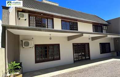 Imagem: A casa possui 4 Dormitórios, 5 Banheiros, 5 Vagas na garagem