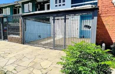 Imagem: A casa possui 2 Dormitórios, 1 Banheiro, 2 Vagas na garagem