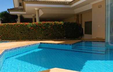 Imagem: A casa em condomínio possui 4 Dormitórios, 5 Banheiros, 4