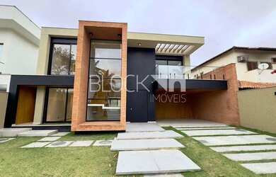 Imagem: A casa em condomínio possui 5 Dormitórios, 5 Banheiros, 4