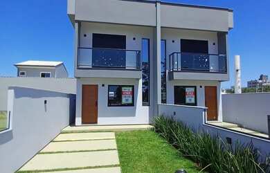 Imagem: A casa possui 2 Dormitórios, 3 Banheiros, 2 Vagas na garagem