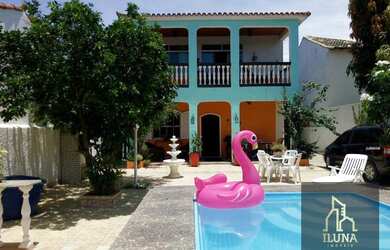 Imagem: A casa possui 5 Dormitórios, 3 Banheiros, 5 Vagas na garagem