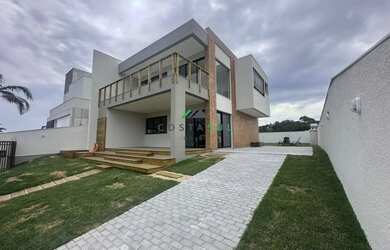 Imagem: A casa possui 3 Dormitórios, 3 Banheiros, 3 Vagas na garagem