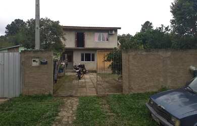 Imagem: A casa possui 3 Dormitórios, 1 Banheiro, 3 Vagas na garagem