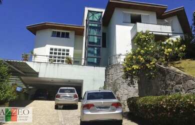 Imagem: A casa possui 4 Dormitórios, 5 Banheiros, 5 Vagas na garagem