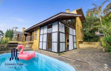 Imagem: A casa em condomínio possui 4 Dormitórios, 4 Banheiros, 2