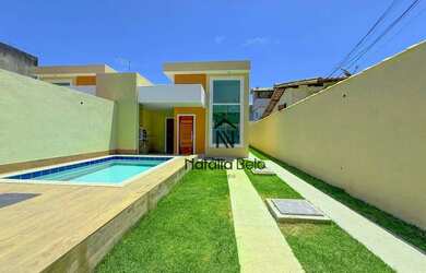 Imagem: A casa e possui 3 Dormitórios, Suítes, 2 Banheiros, 2 Vagas