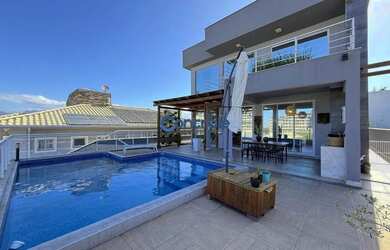 Imagem: A casa possui 5 Dormitórios, 5 Banheiros, 5 Vagas na garagem