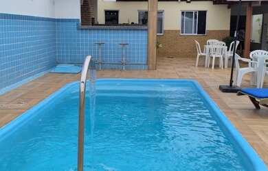 Imagem: A casa possui 5 Dormitórios, 3 Vagas na garagem e está localizado