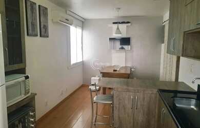 Imagem: O apartamento possui 2 Dormitórios, 1 Banheiro, 1 Vaga na garagem