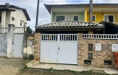 Imagem: A casa possui 2 Dormitórios, 3 Banheiros, 1 Vaga na garagem