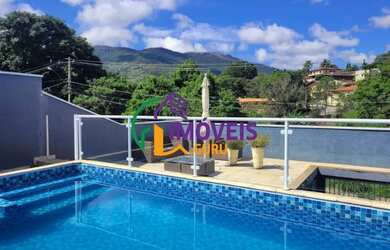 Imagem: A casa possui 4 Dormitórios, 4 Banheiros, 2 Vagas na garagem