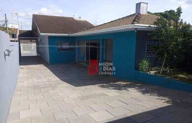 Imagem: A casa possui 3 Dormitórios, 3 Banheiros, 5 Vagas na garagem