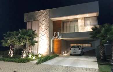 Imagem: A casa possui 4 Dormitórios, 5 Banheiros, 4 Vagas na garagem