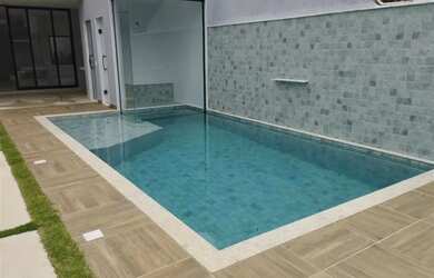 Imagem: A casa em condomínio possui 4 Dormitórios, 5 Banheiros, 2