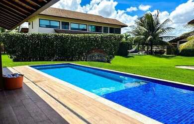 Imagem: A casa possui 5 Dormitórios, 5 Banheiros, 4 Vagas na garagem