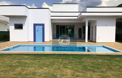 Imagem: A casa possui 4 Dormitórios, 5 Banheiros, 4 Vagas na garagem