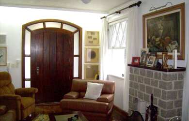 Imagem 1: Casa em Guarujá. Churrasqueira, Varanda, Área de serviçoeLareira