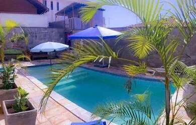 Imagem: A casa possui 5 Dormitórios, 5 Banheiros, 5 Vagas na garagem