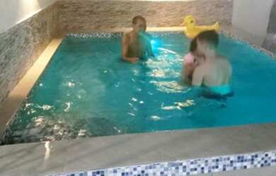 Imagem: A casa possui 4 Dormitórios, 4 Banheiros, 2 Vagas na garagem