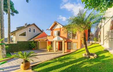 Imagem: A casa possui 3 Dormitórios, 5 Banheiros, 5 Vagas na garagem