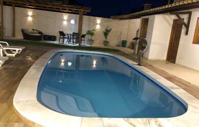 Imagem: A casa possui 4 Dormitórios, 4 Banheiros, 4 Vagas na garagem