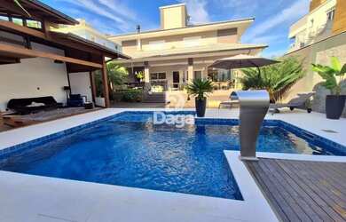 Imagem: A casa possui 5 Dormitórios, 5 Banheiros, 2 Vagas na garagem