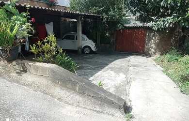 Imagem: A casa possui 5 Dormitórios, 2 Banheiros, 5 Vagas na garagem