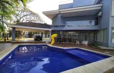 Imagem: A casa possui 5 Dormitórios, 5 Banheiros, 5 Vagas na garagem