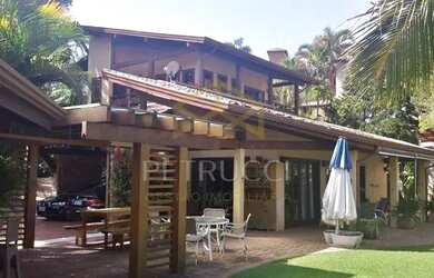 Imagem: A casa em condomínio possui 4 Dormitórios, 5 Banheiros, 5