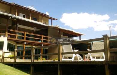 Imagem: A casa em condomínio possui 3 Dormitórios, 5 Banheiros, 620m²