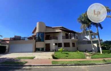 Imagem: A casa em condomínio possui 5 Dormitórios, 5 Banheiros, 4