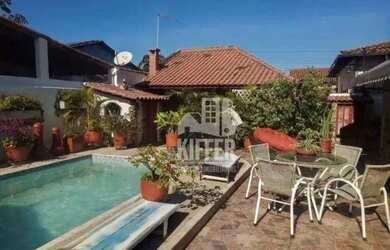 Imagem: A casa possui 4 Dormitórios, 4 Banheiros, 3 Vagas na garagem