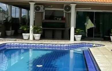 Imagem: A casa possui 5 Dormitórios, 5 Banheiros, 4 Vagas na garagem