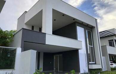 Imagem: A casa possui 4 Dormitórios, 5 Banheiros, 4 Vagas na garagem