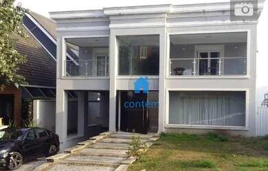 Imagem: A casa em condomínio possui 4 Dormitórios, 4 Banheiros, 5