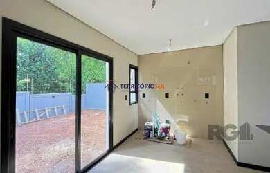 Imagem 13: Casa em Porto Alegre, no bairro Hípica, com 3 dormitório s , e 3 banheiros,...