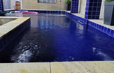 Imagem: A casa possui 2 Dormitórios, Acomodam 10 pessoas, 1 Vaga na