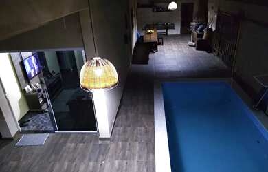 Imagem: A casa possui 3 Dormitórios, 3 Banheiros, 3 Vagas na garagem